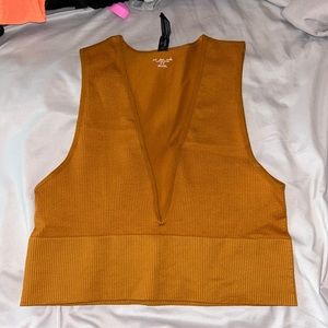 Urban Outfitters out from under tank top